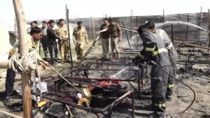 Firefighters douse a fire that broke out at a camp during Maha Kumbh festival

